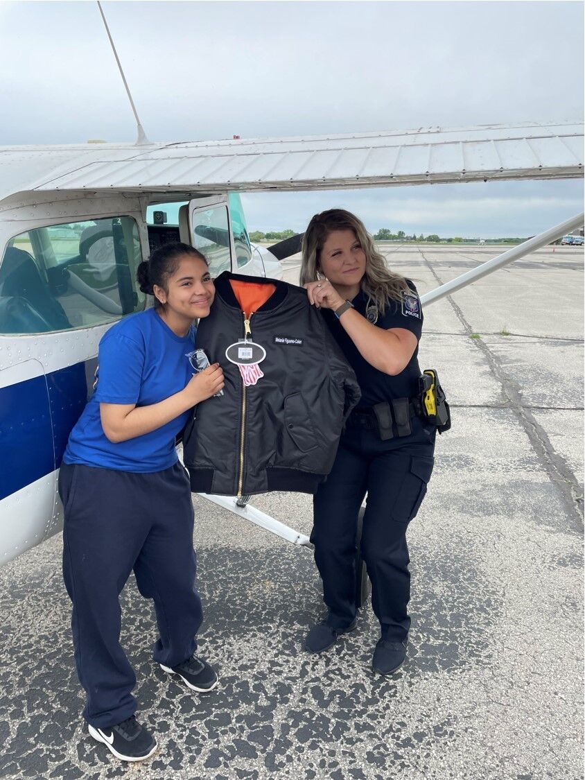 Melanie Figuereo-Colon with Officer Dana Juopperi